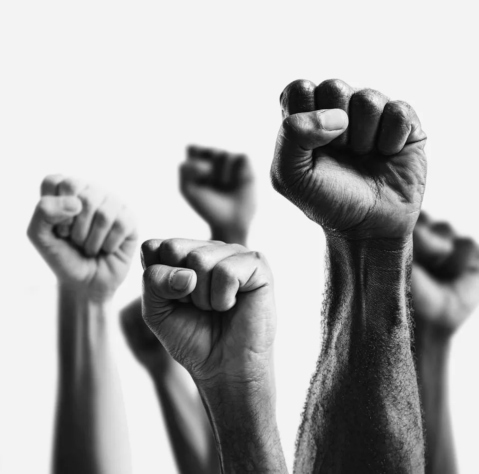 Raised fists symbolising commitment