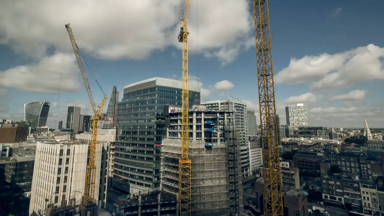 Tower cranes over an active commercial construction site